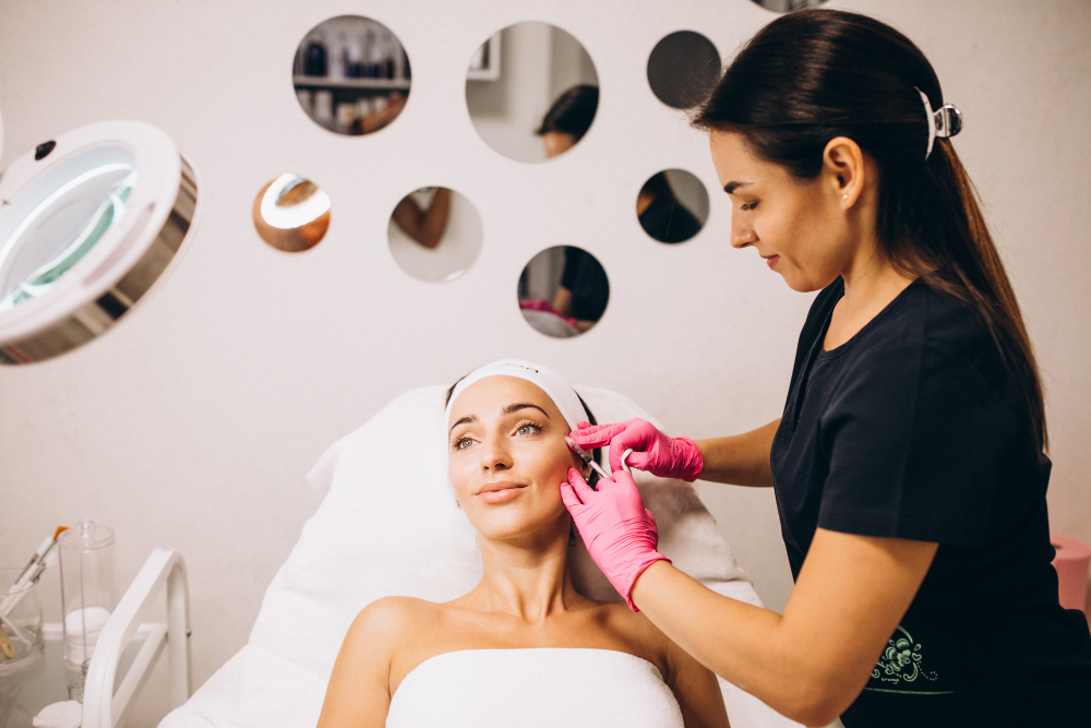 cosmetologist making injections face woman beauty salon