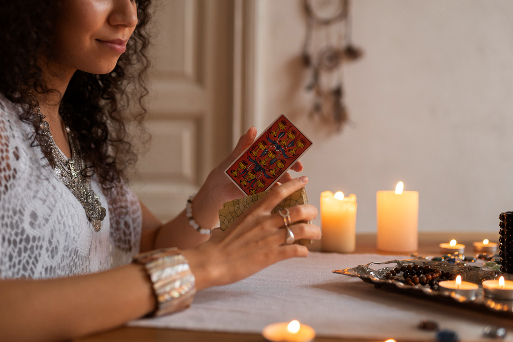 side view woman reading tarot home